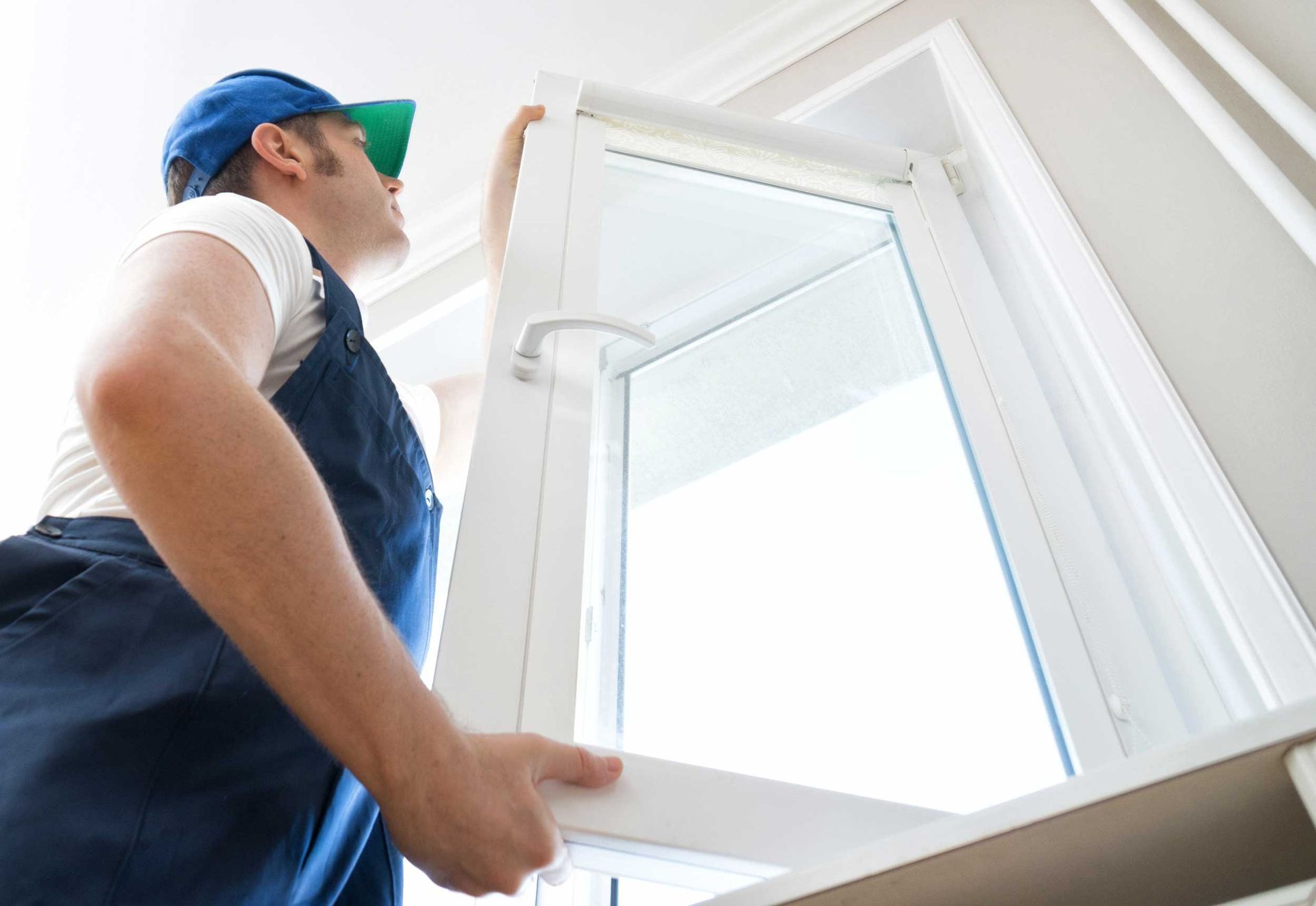 A man is installing a window.