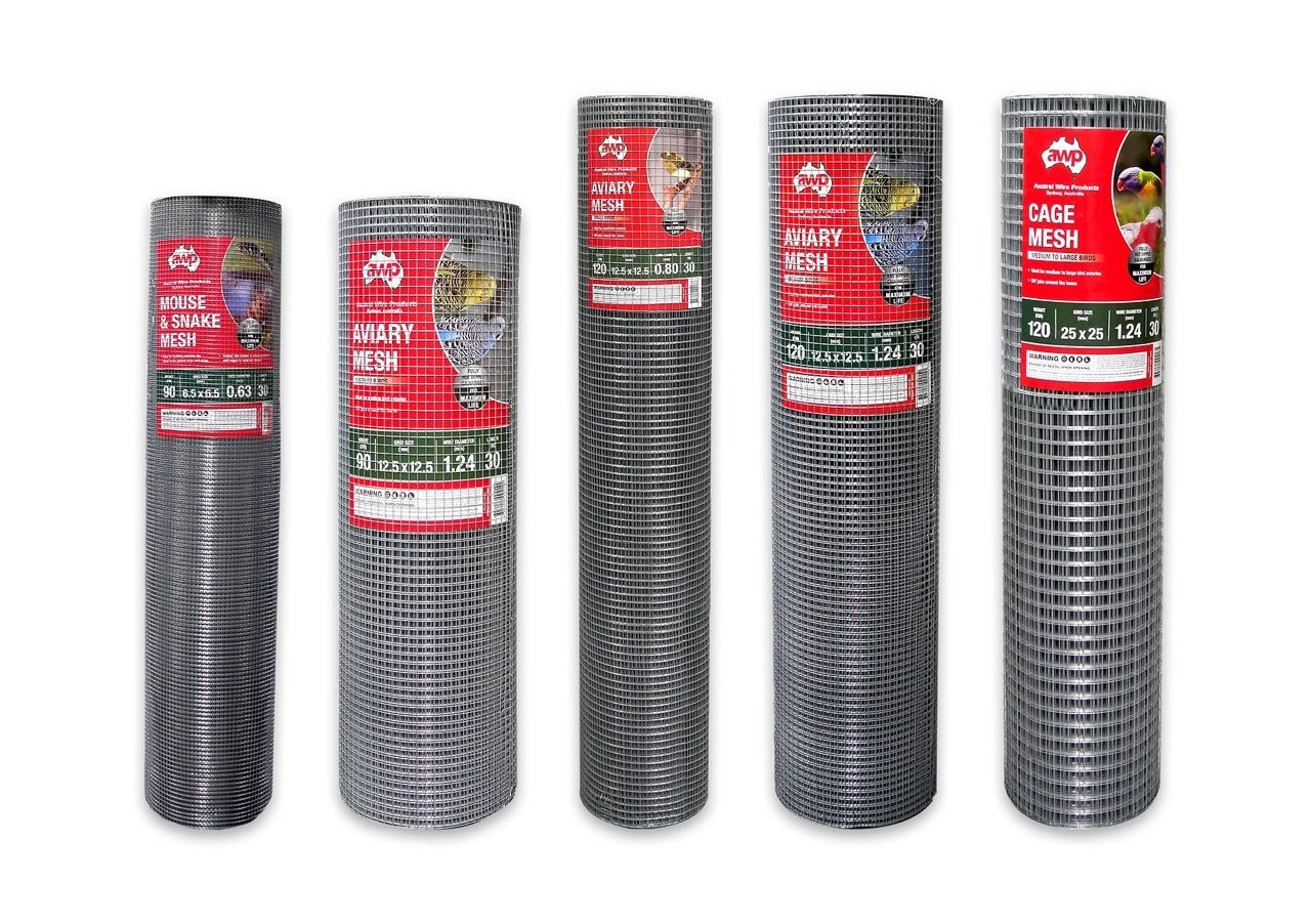 Five rolls of various steel wire mesh fencing standing side-by-side on a white background.