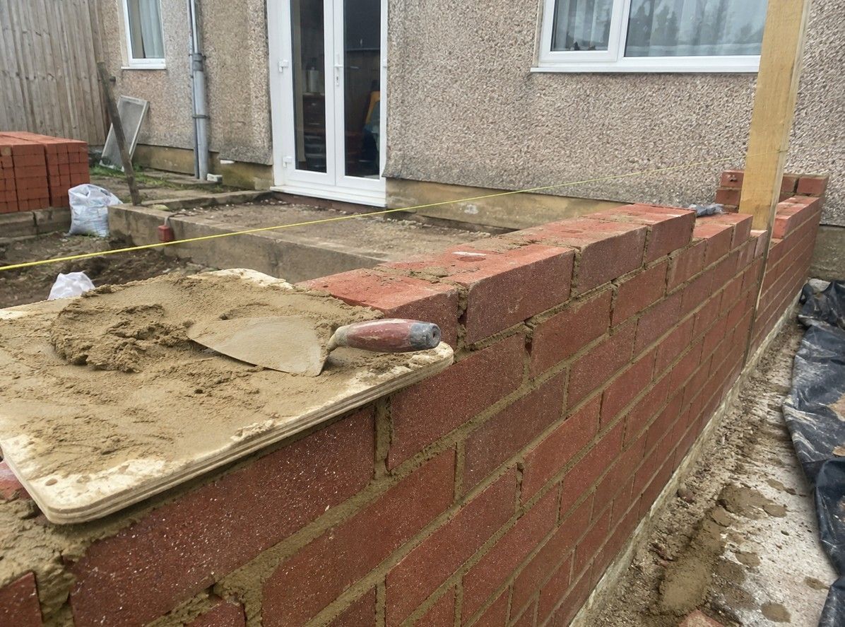 J&Z Property Maintenance builders carrying out brickwork at a property in Barry