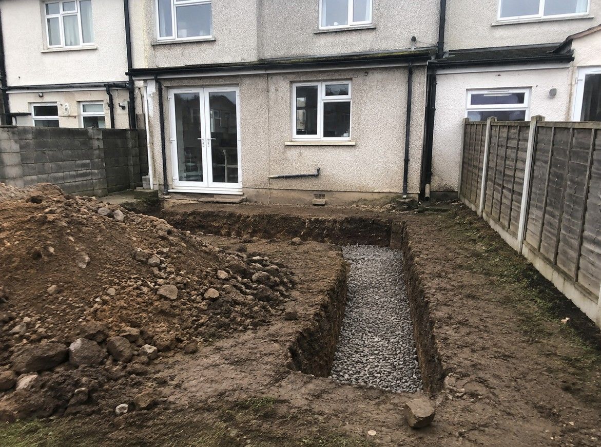 J&Z Property Maintenance excavating foundations at a property in Barry