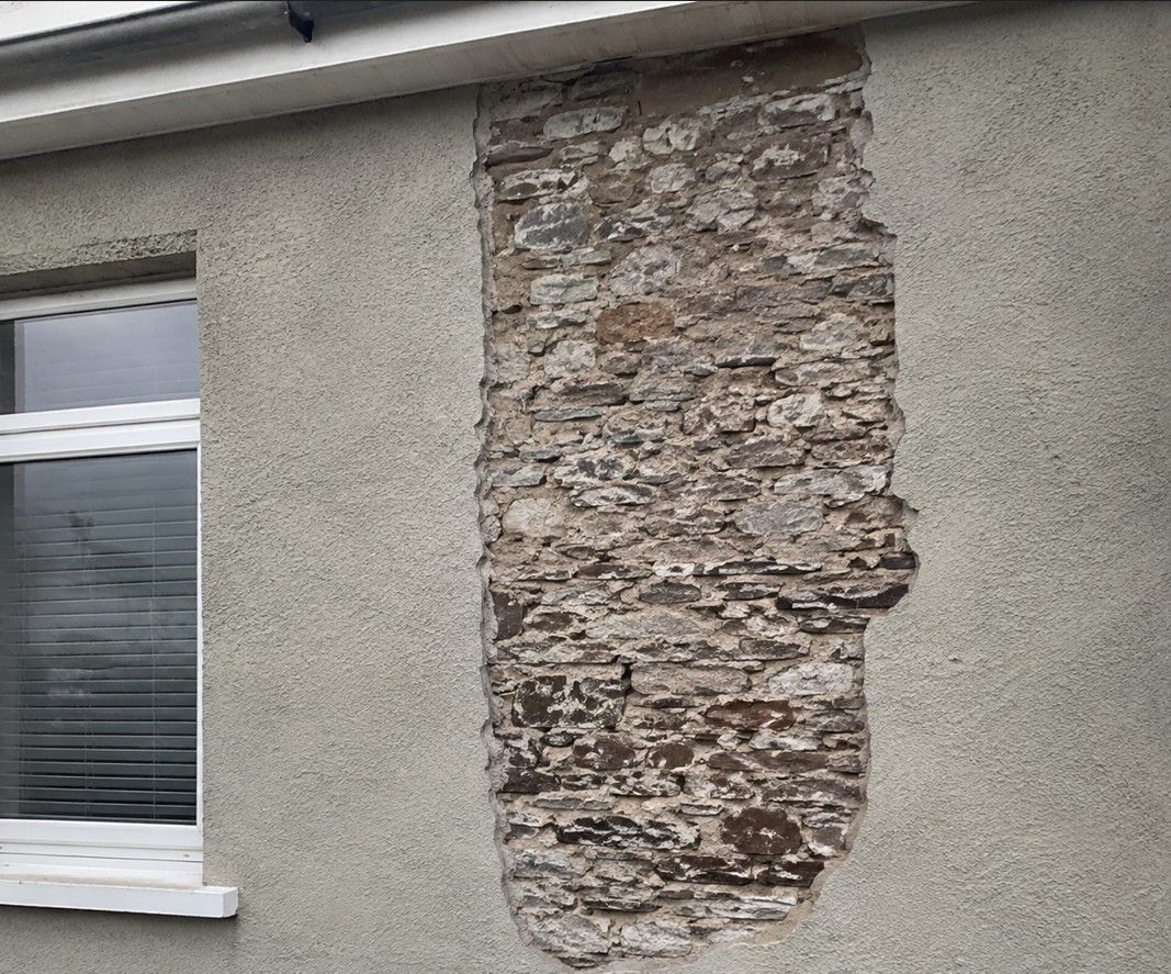 J&Z Property Maintenance repairing failed render on a coastal property in Barry