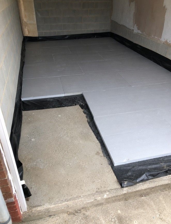 J&Z Property Maintenance laying an insulated floor with damp proof membrane in a Cardiff garage conversion