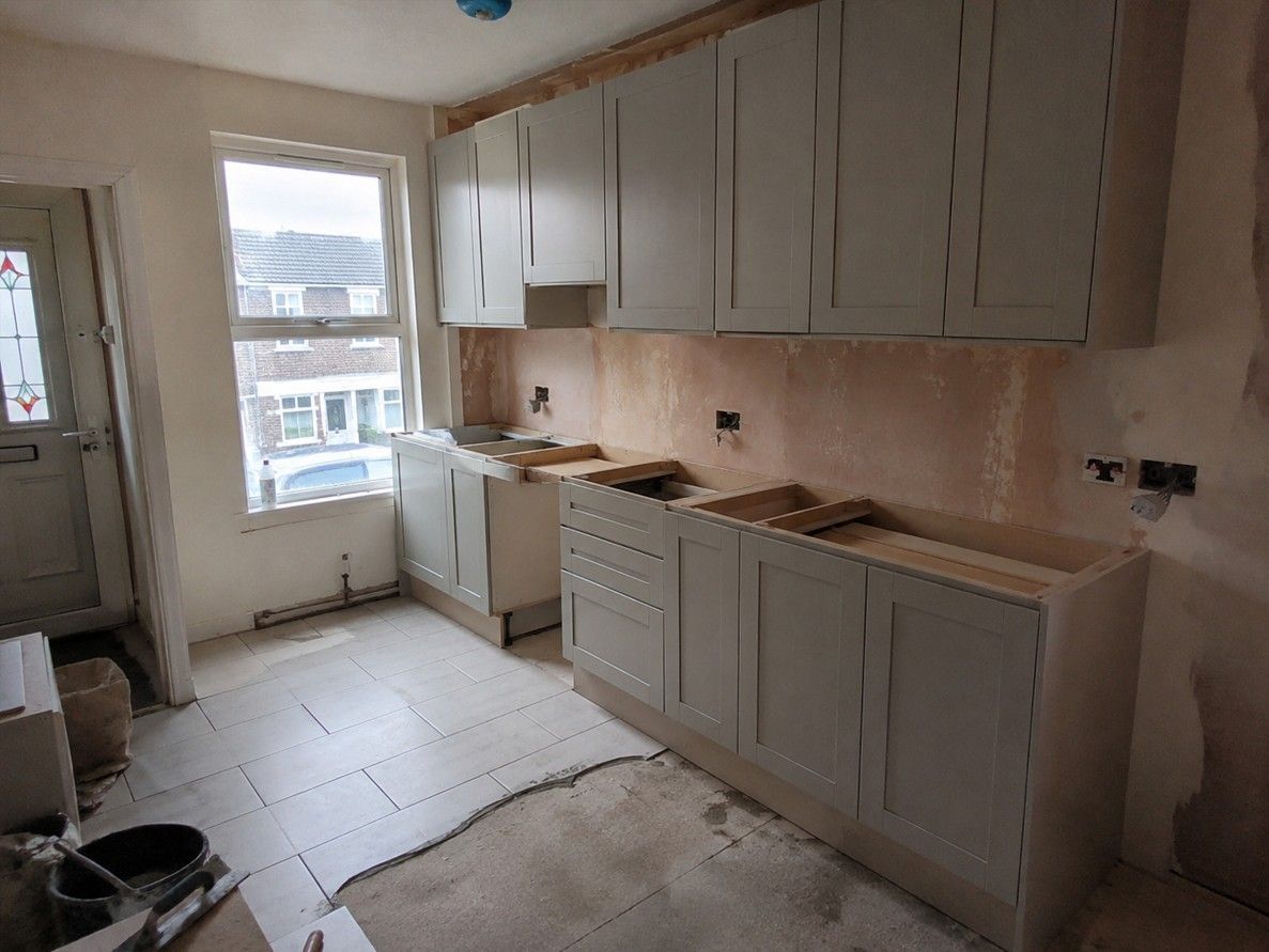 J&Z Property Maintenance fitting a new kitchen in a Cardiff home