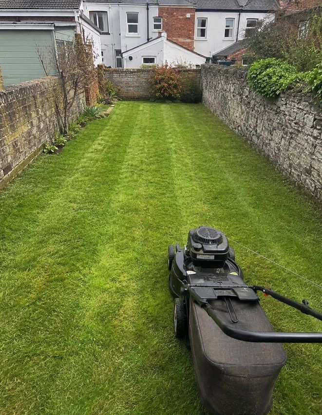 J&Z Property Maintenance mowing a lawn at a Cardiff residential property