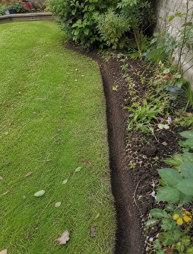 J&Z Property Maintenance edging a lawn border in Cardiff