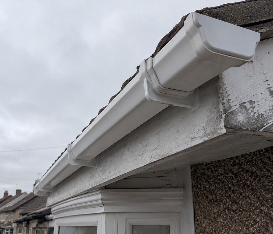 J&Z Property Maintenance handyman fitting shelves at a Barry home