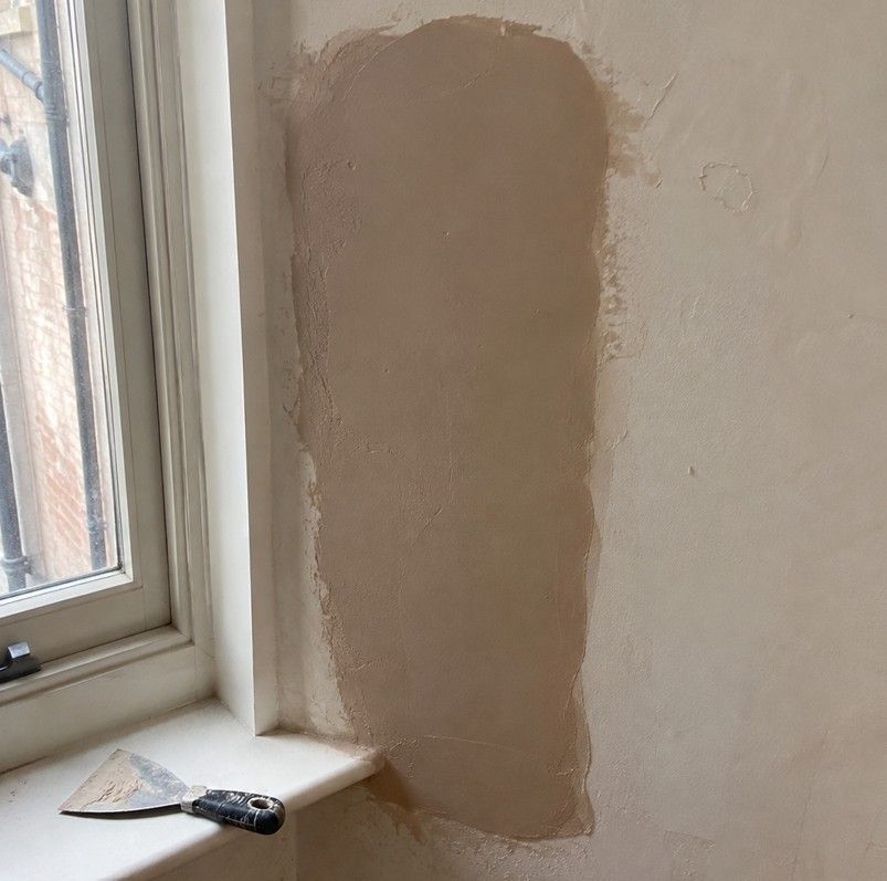 J&Z Property Maintenance handyman repairing a drywall hole at a Barry property