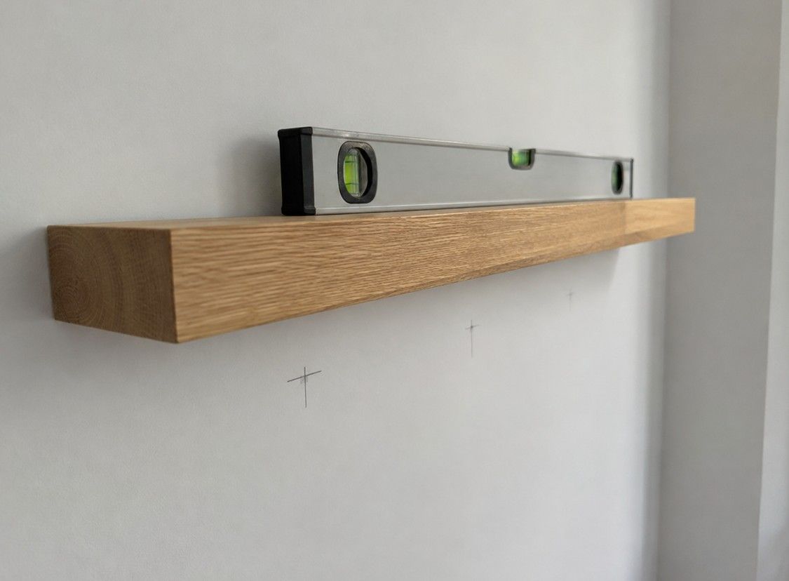 J&Z Property Maintenance handyman fitting shelves at a Barry home
