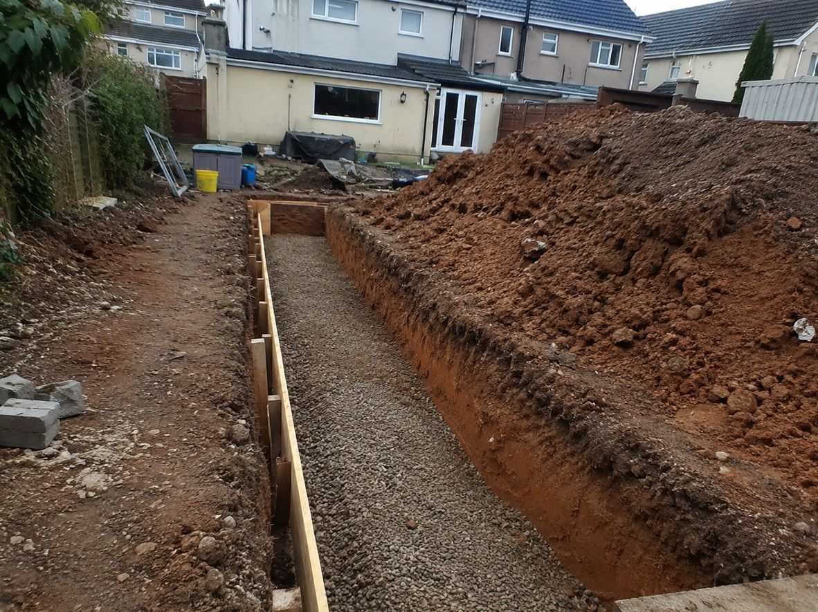 J&Z Property Maintenance excavating foundations at a property in Newport