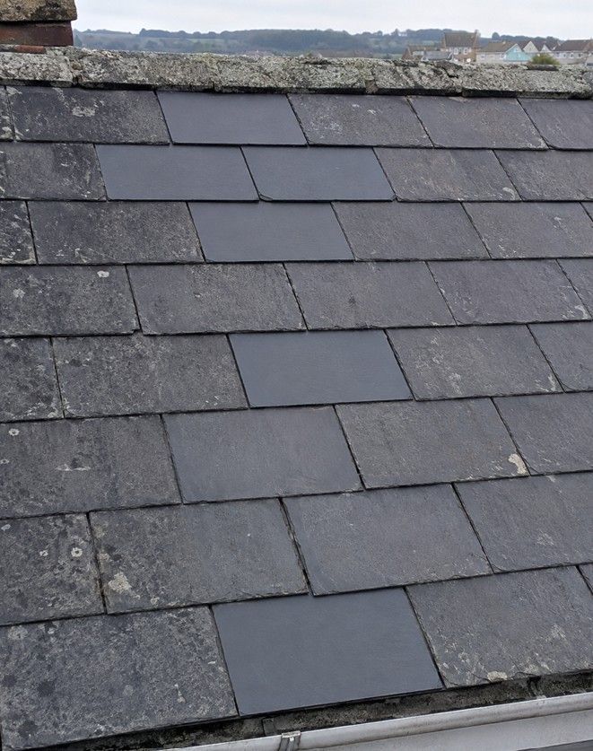 J&Z Property Maintenance replacing slipped slates on a terraced roof in Barry