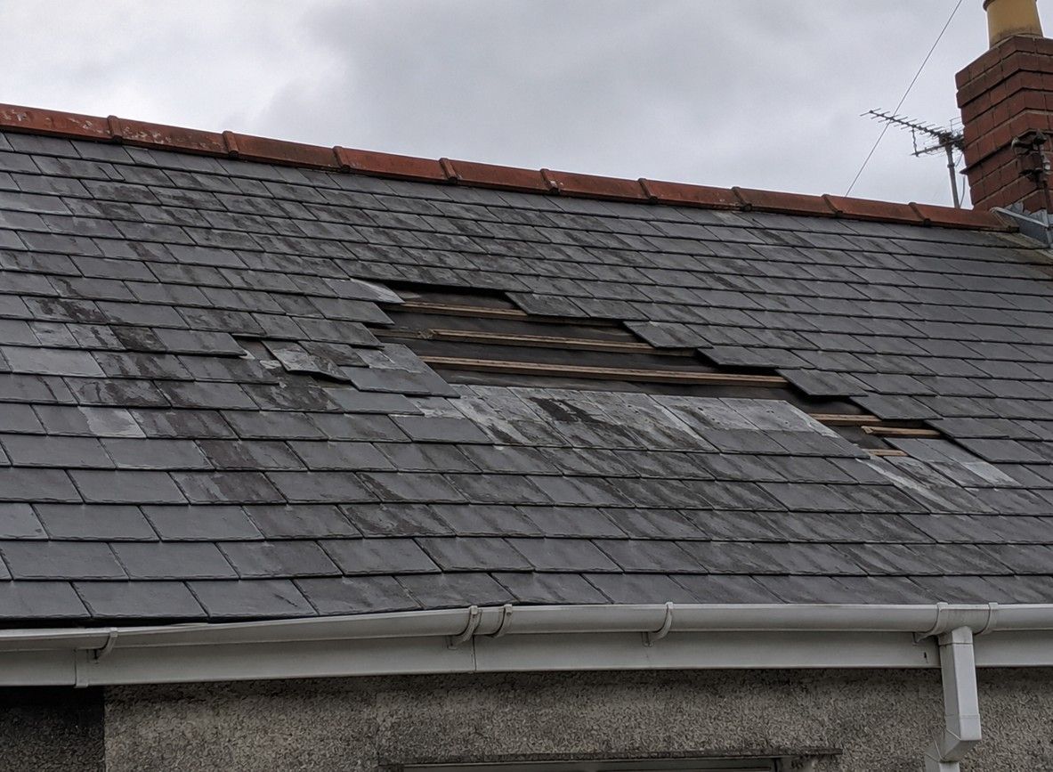 Storm damaged roof on a Barry property before repair by J&Z Property Maintenance