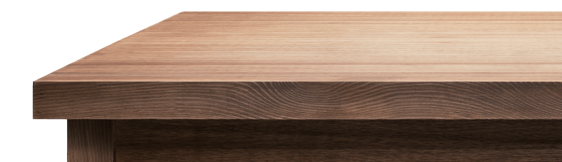 Close-up of a wooden tabletop edge with a light brown top and dark wood side panel.
