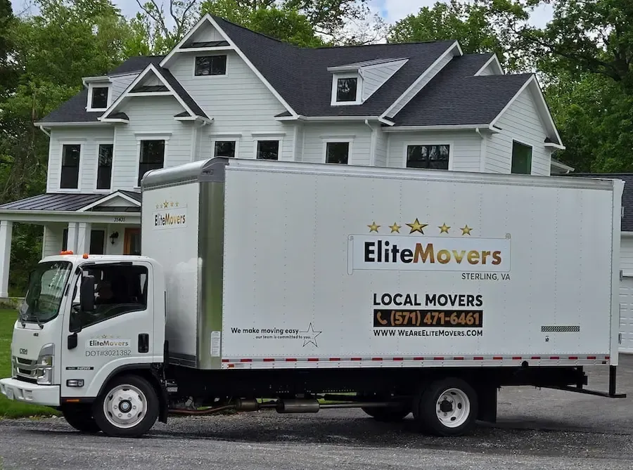 white box truck is parked in the driveway