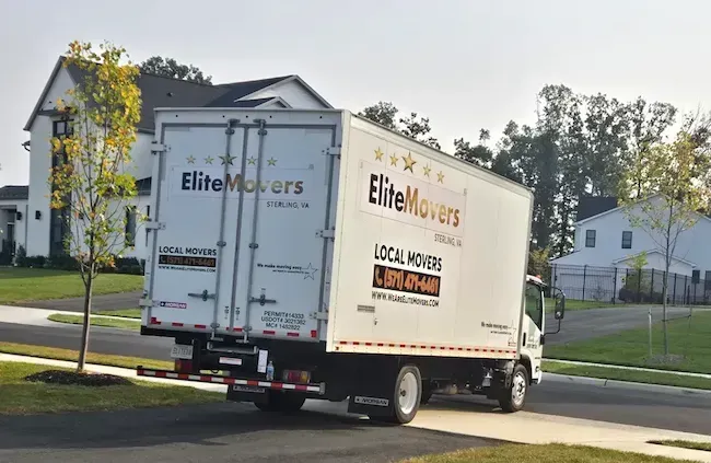 a white box truck is getup of the driveway