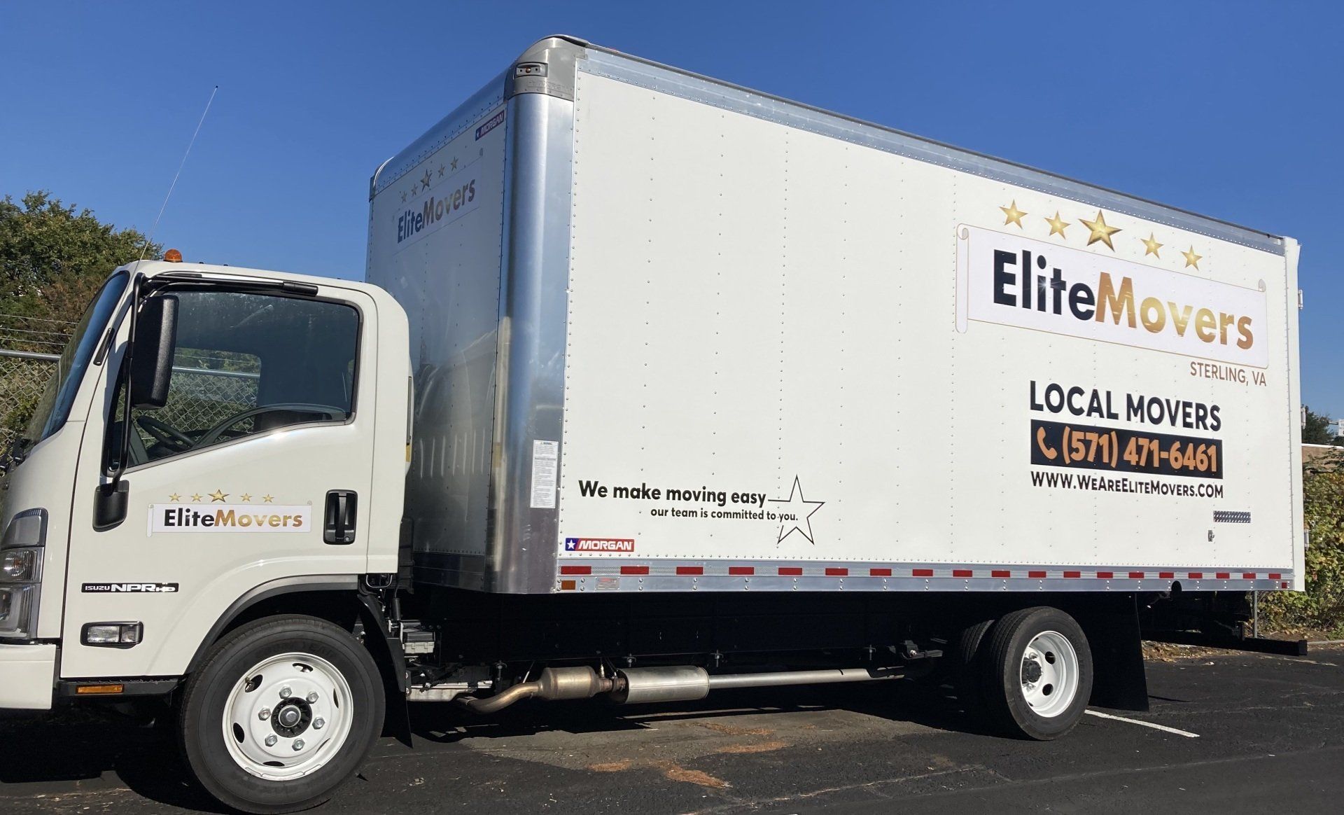 a 20 ft box truck parked  fully wrap with our logo