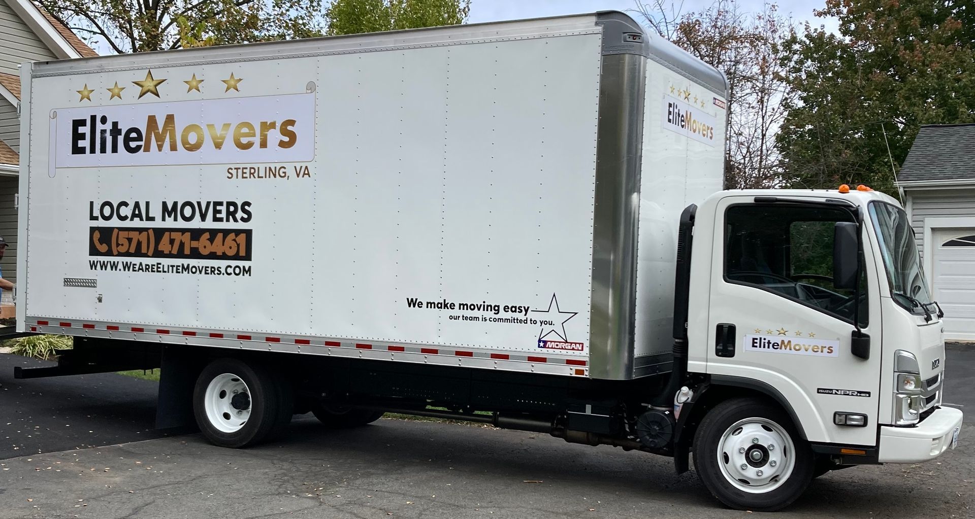 box truck is parked in the driveway