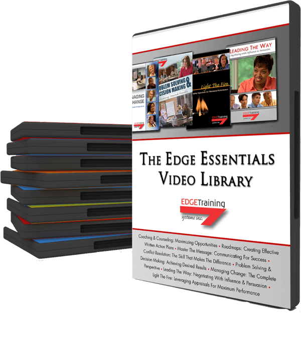 Stack of video discs beside a white-and-black “The Edge Essentials Video Library” case with red accents.