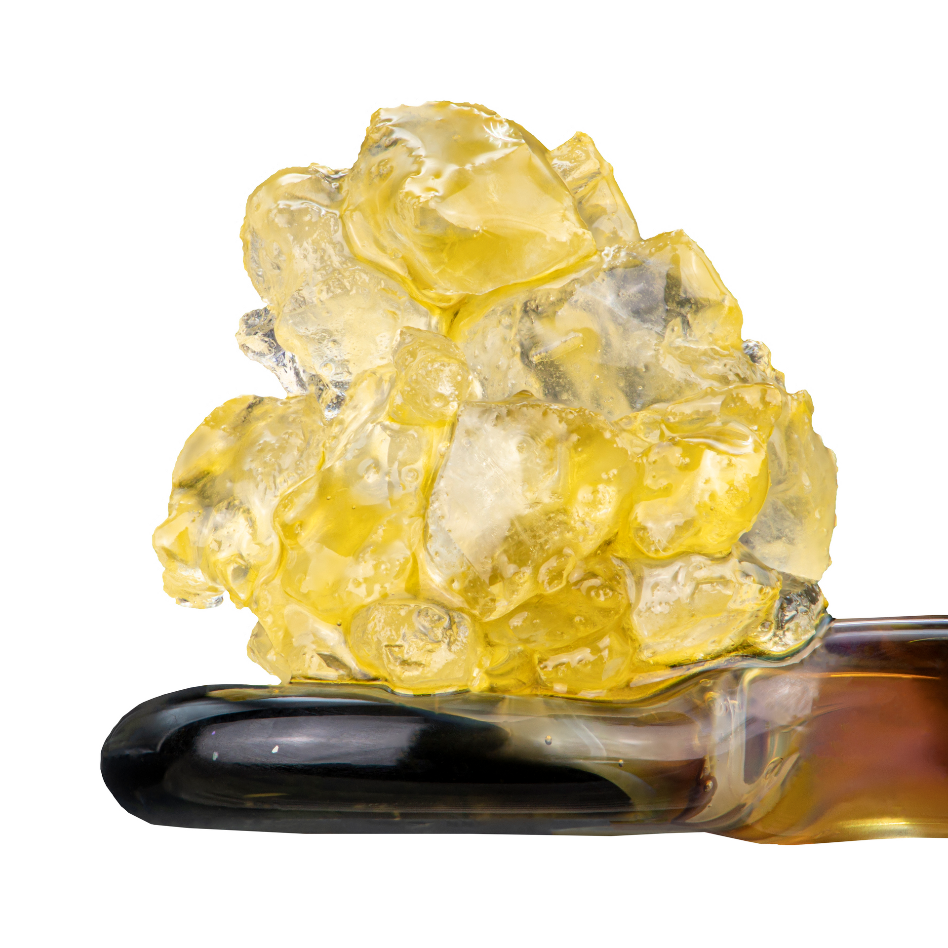 A close up of a gummy bear sitting on top of a pen.