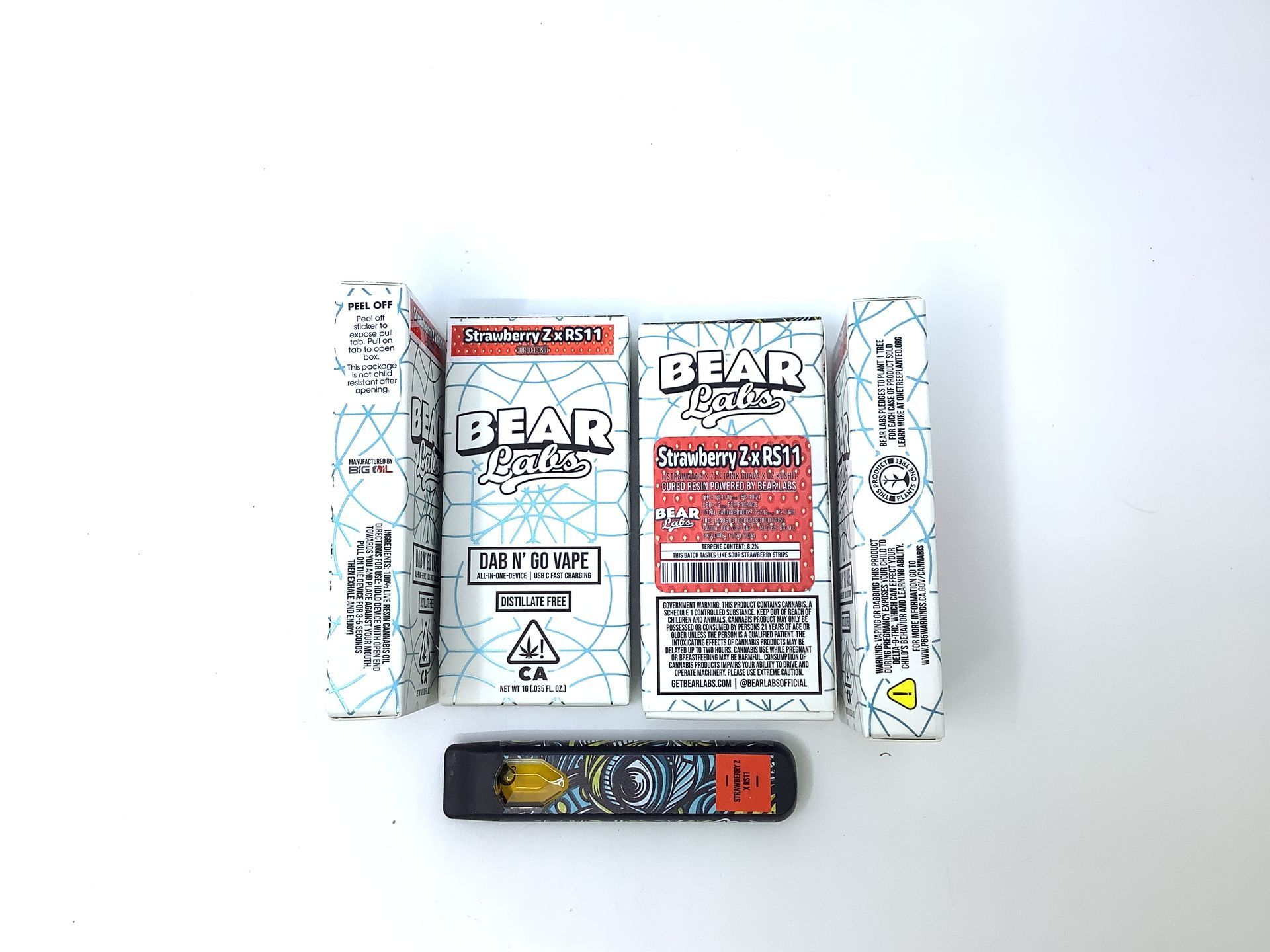 A box of bear labs next to a jar of Strawberry Z X Rs11 - Aio