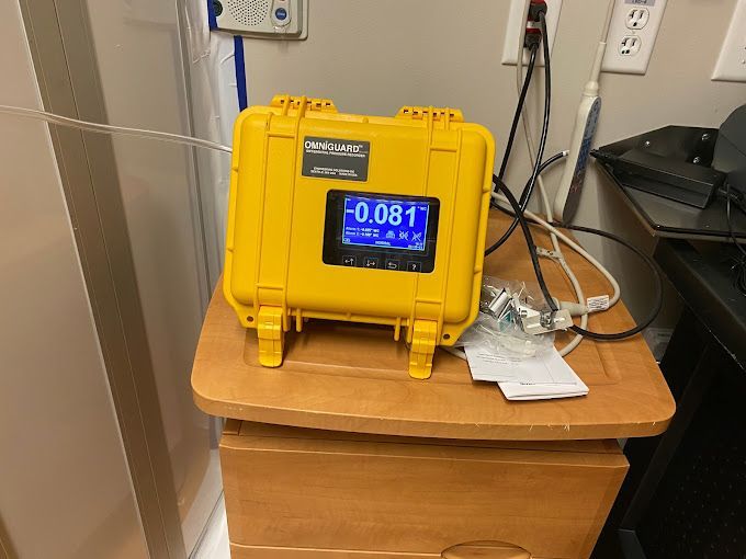 A yellow case with a display that says 0.081 on it