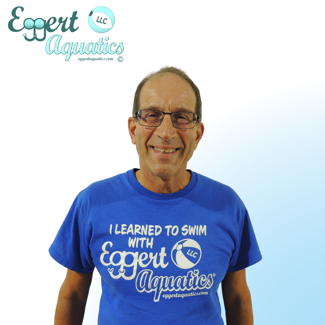 A woman wearing a blue shirt that says expert aquatics