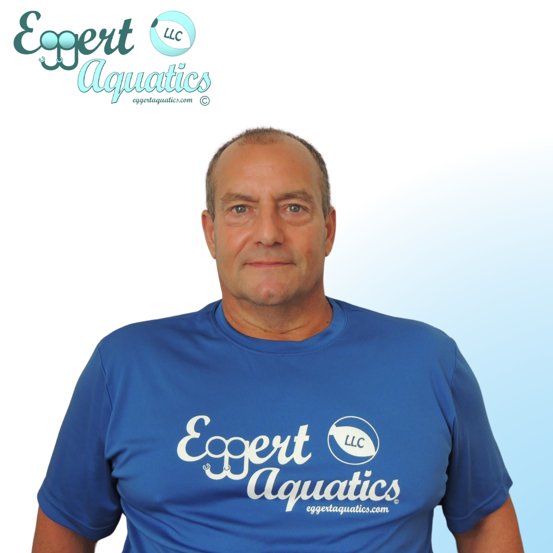 A woman wearing a blue shirt that says expert aquatics