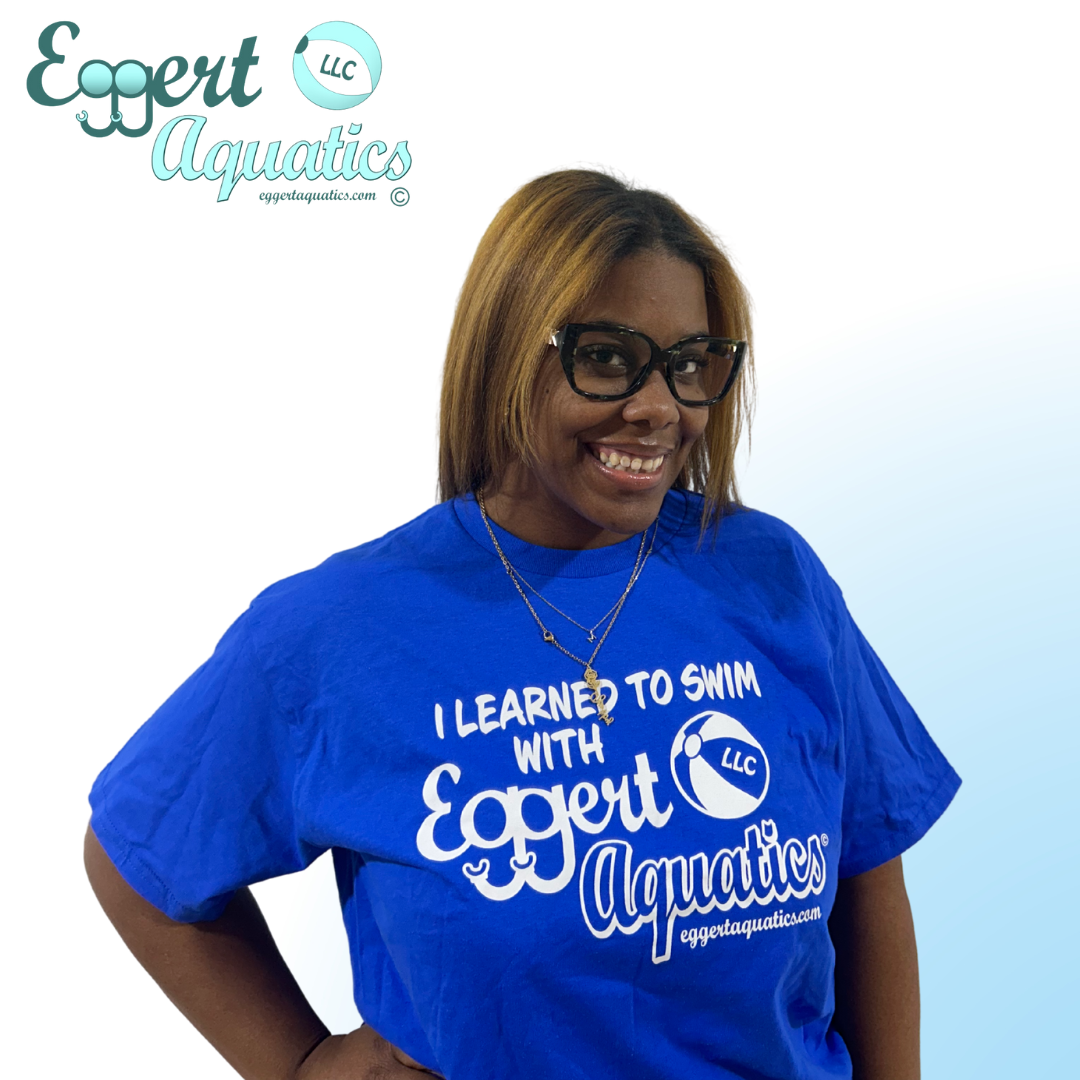 A woman wearing glasses and a blue shirt that says expert aquatics