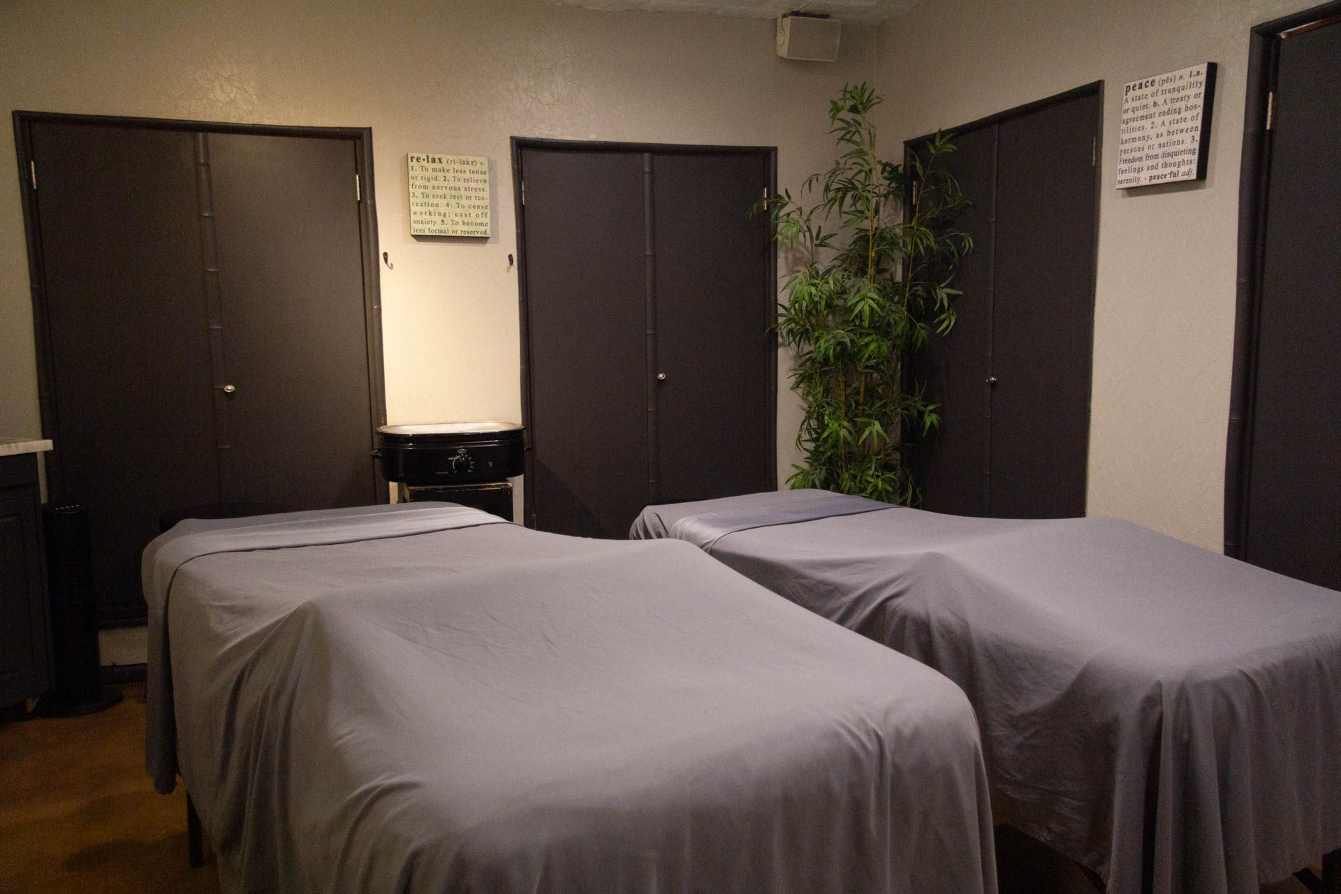 three massage beds are lined up in a room .
