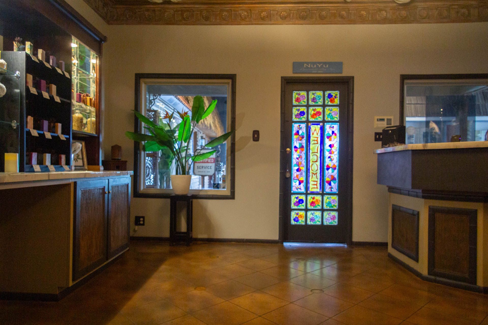 there is a stained glass door in the middle of the room .
