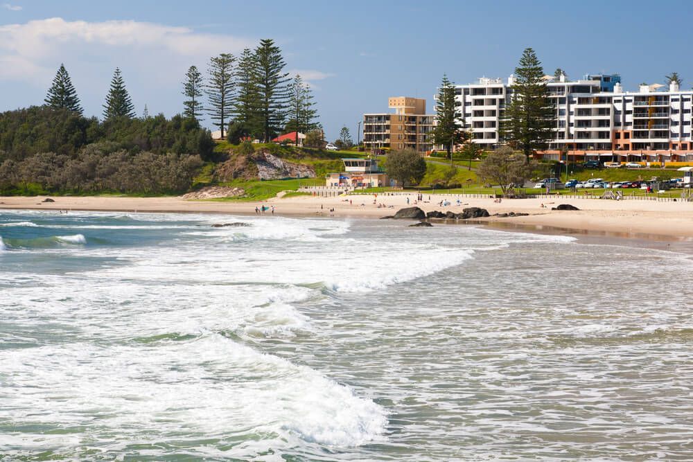 A Beach With A Lot Of Buildings In The Background — Lighthouse Beach Garage Door Service in Port Macquarie, NSW