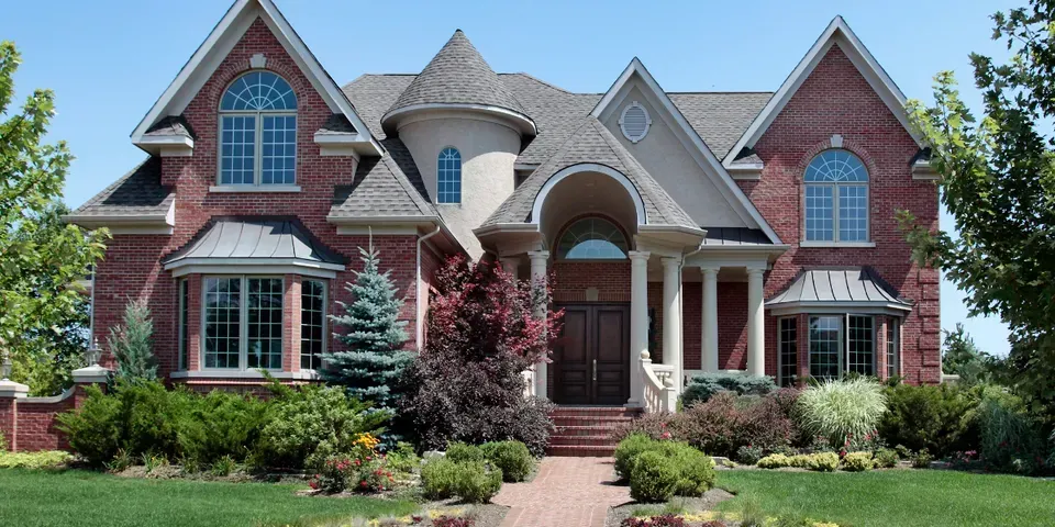 A large brick house with a lot of windows