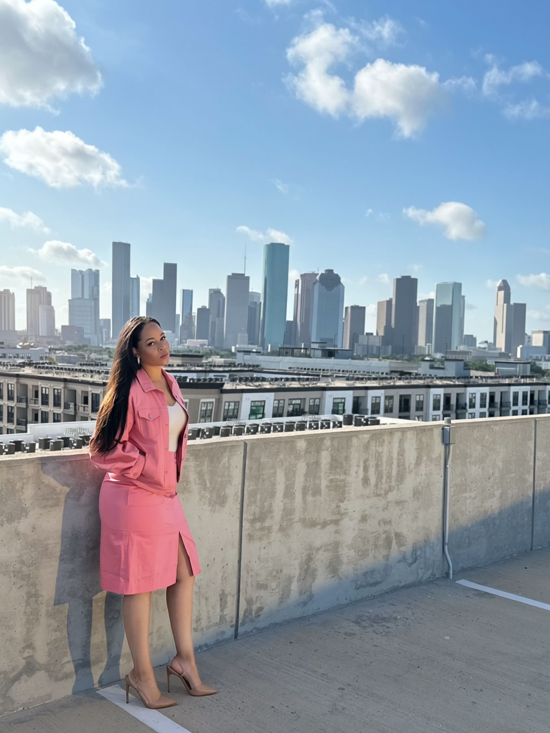 Salmon Pink coordinated outfit — alternate pose against the Houston skyline