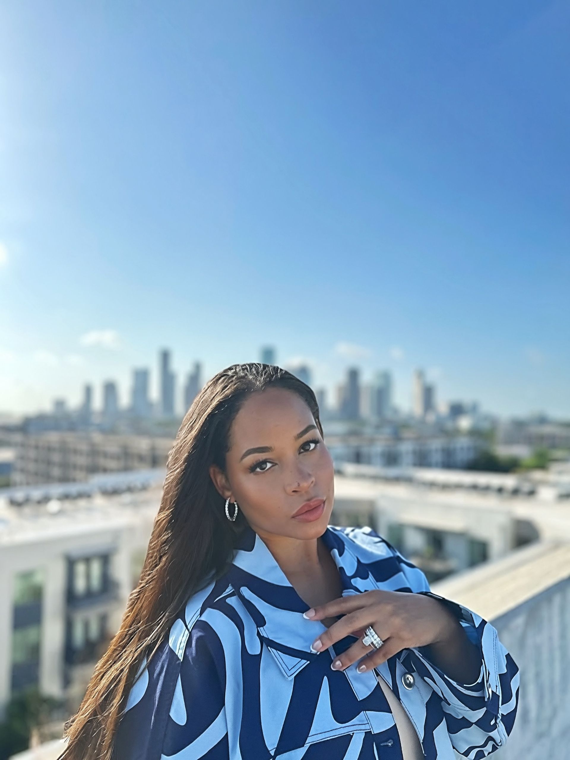 The Blue Print coordinated outfit — alternate pose against the Houston skyline