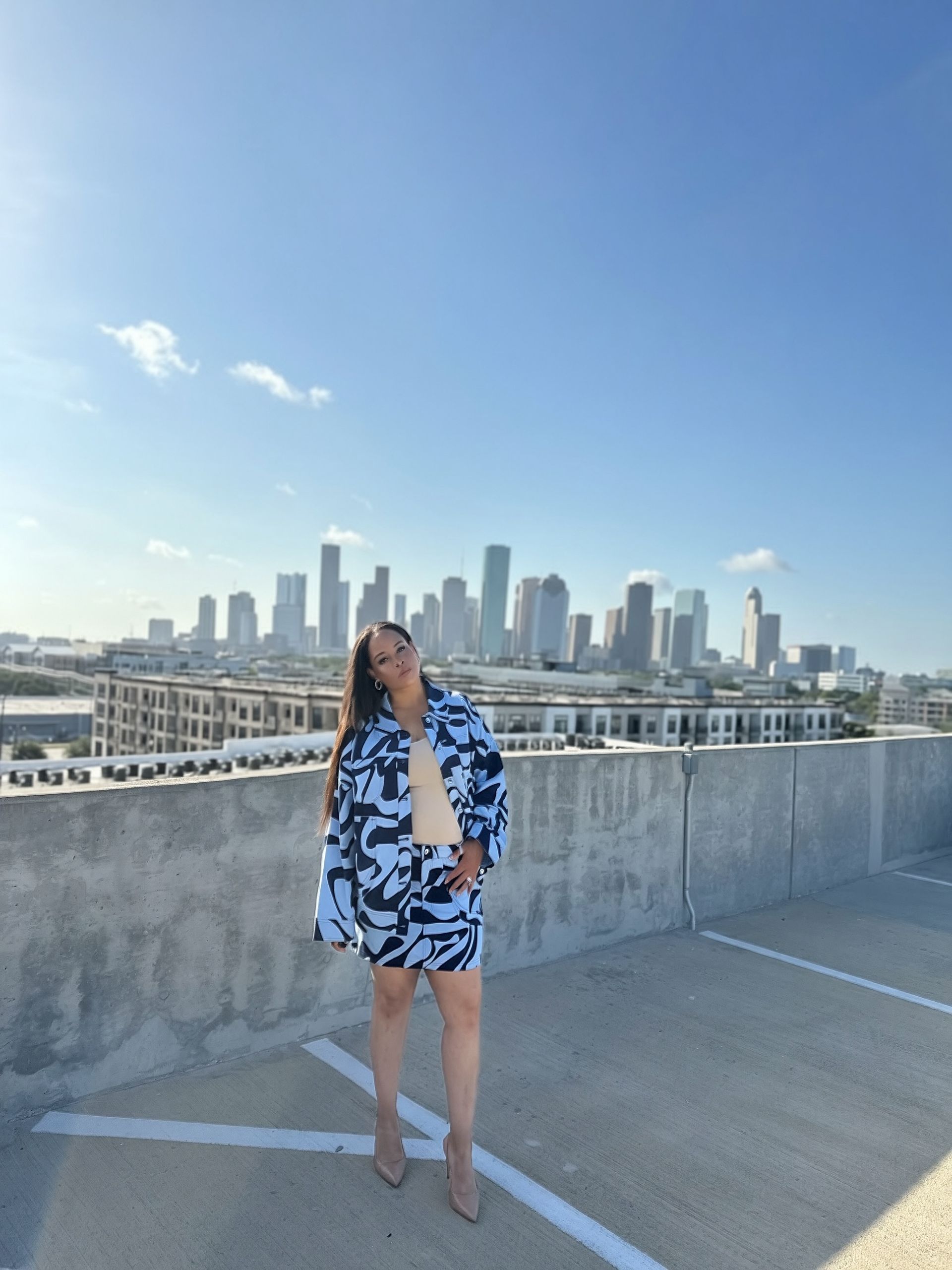 The Blue Print coordinated outfit — alternate pose against the Houston skyline