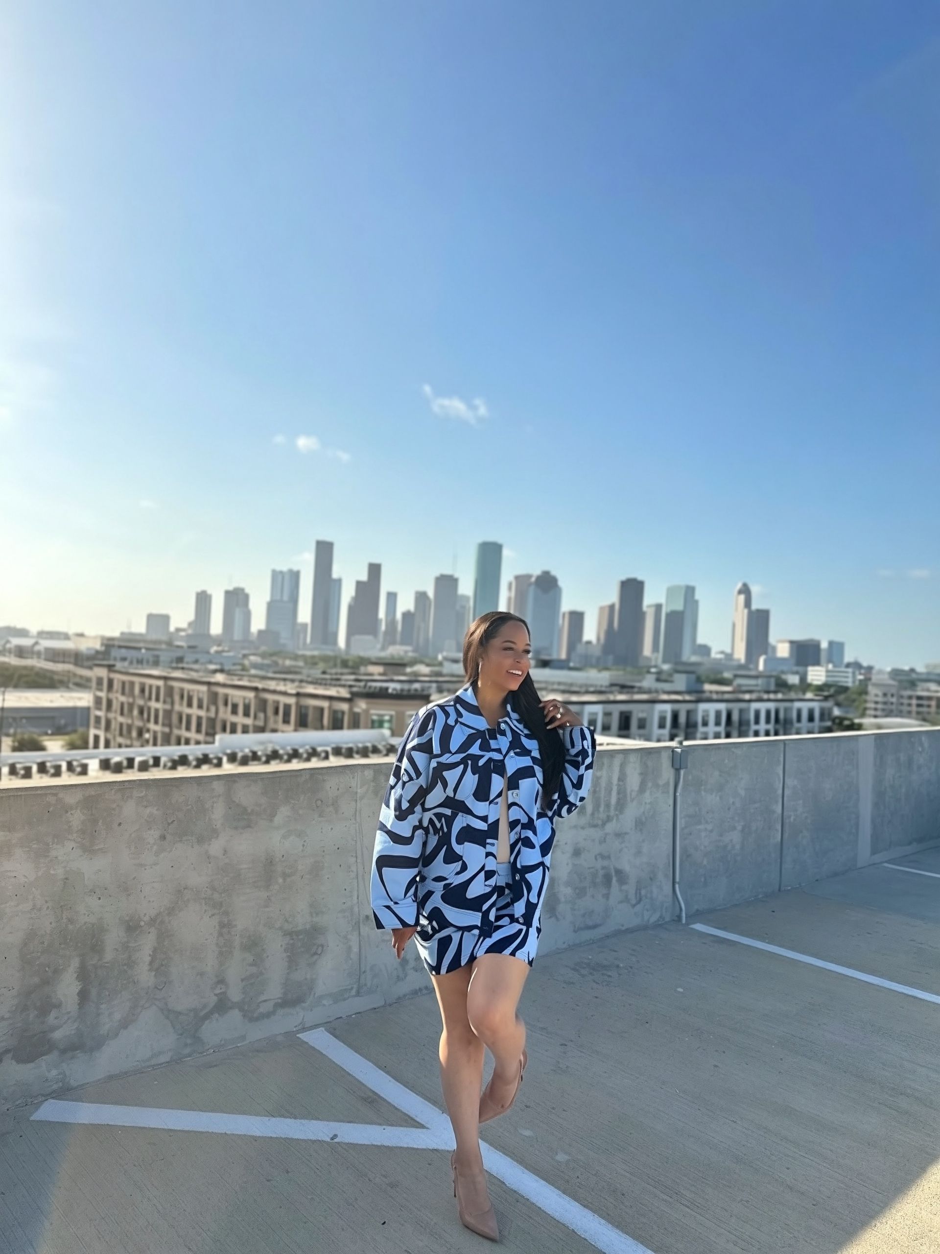 The Blue Print coordinated outfit — alternate pose against the Houston skyline