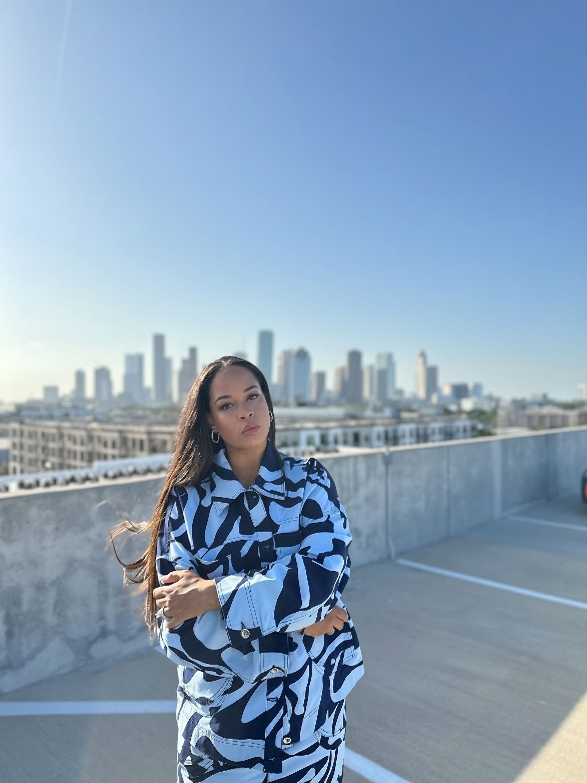 The Blue Print coordinated outfit — alternate pose against the Houston skyline