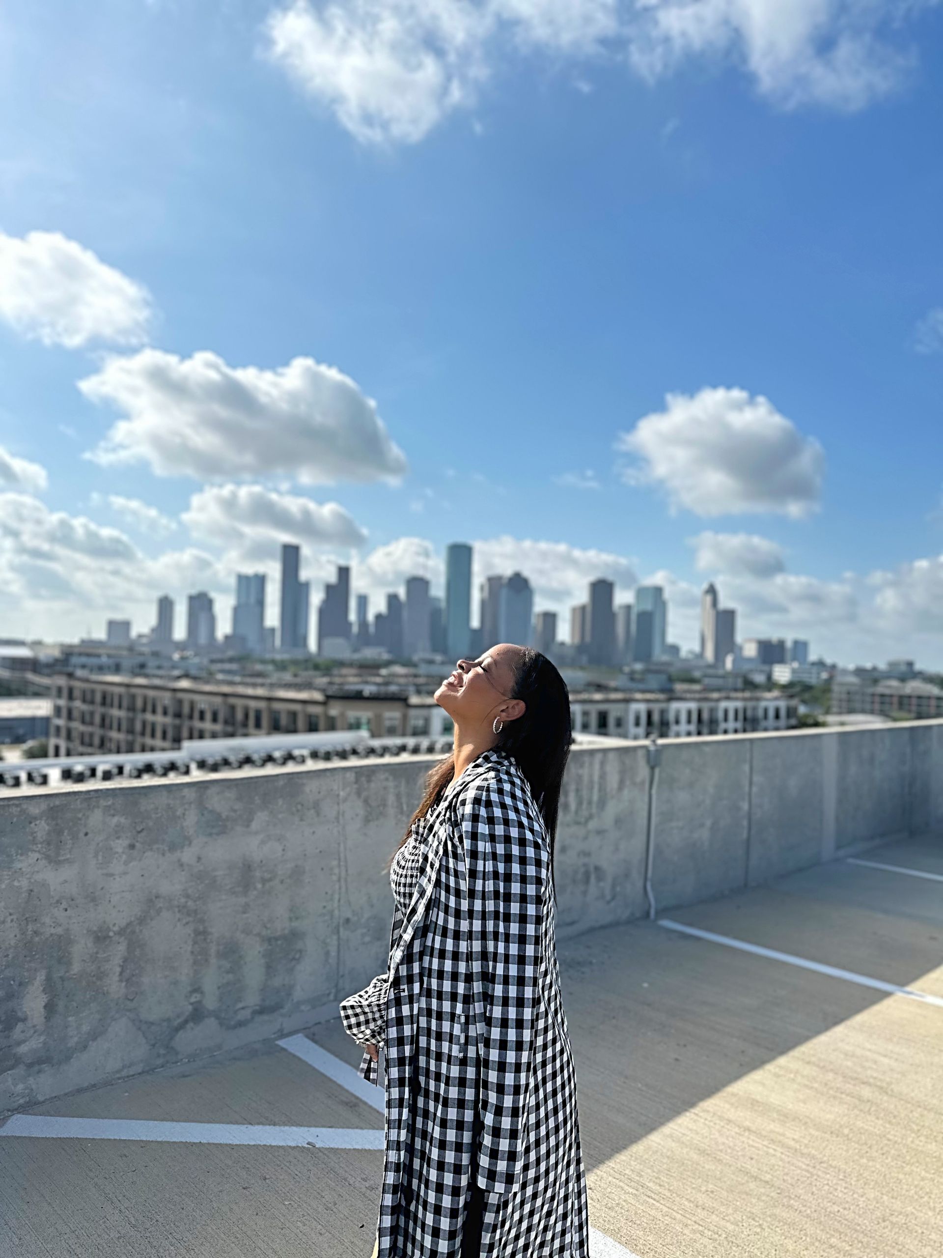 Black and White Checks coordinated outfit — alternate pose against the Houston skyline
