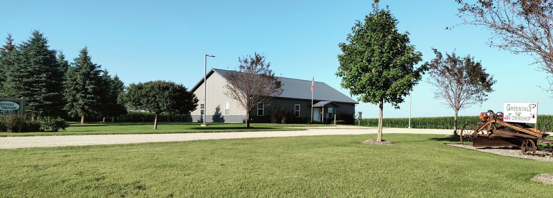 A house sits in the middle of a grassy field