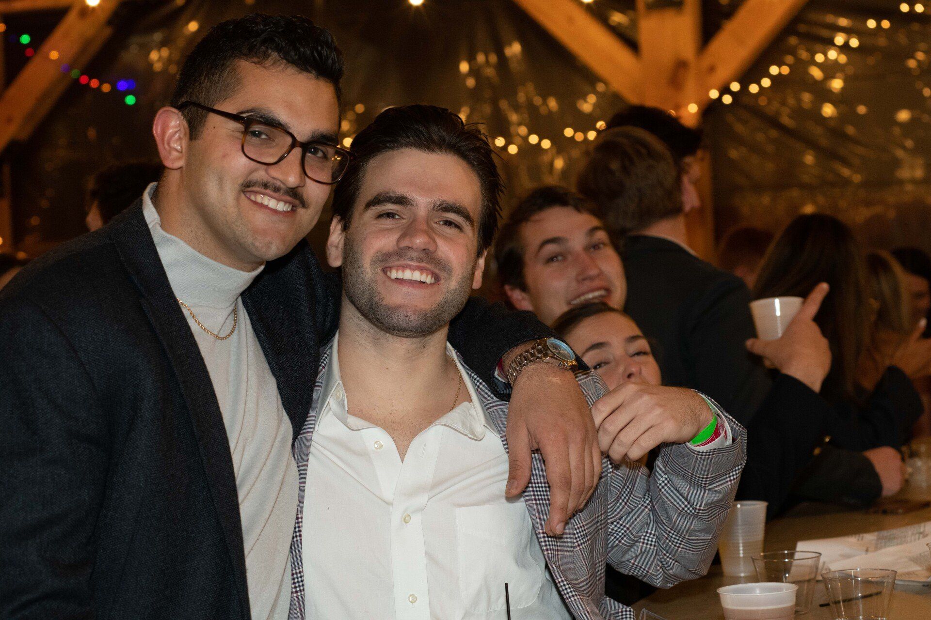 A group of people are posing for a picture at a party.