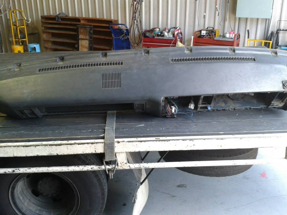 Black Car Dashboard Secured on a Flatbed Truck — Mechanic in Boronia Heights, QLD