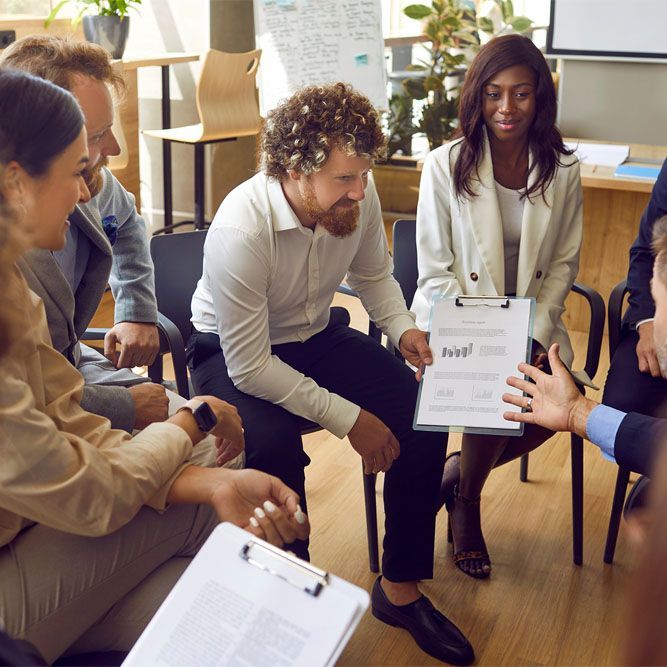 a group of employees having a meeting