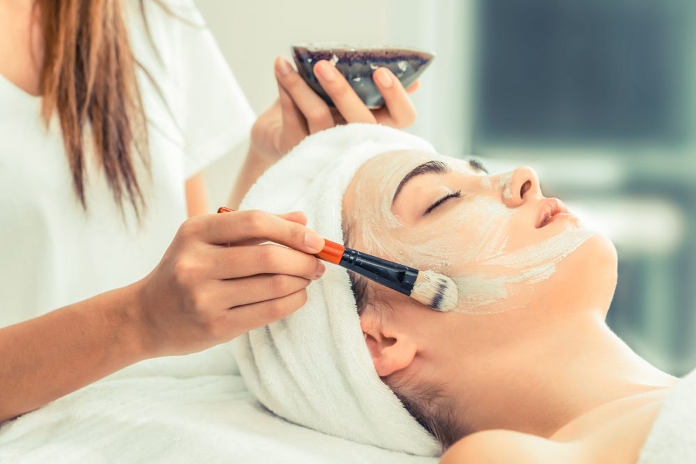 A Woman is Getting a Facial Treatment — Gorjess Aesthetics in Corrimal, NSW