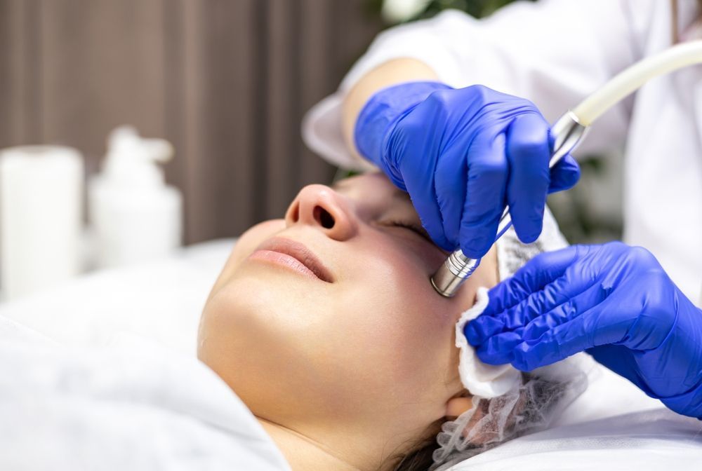 A Woman is Getting a Facial Treatment — Gorjess Aesthetics in Corrimal, NSW
