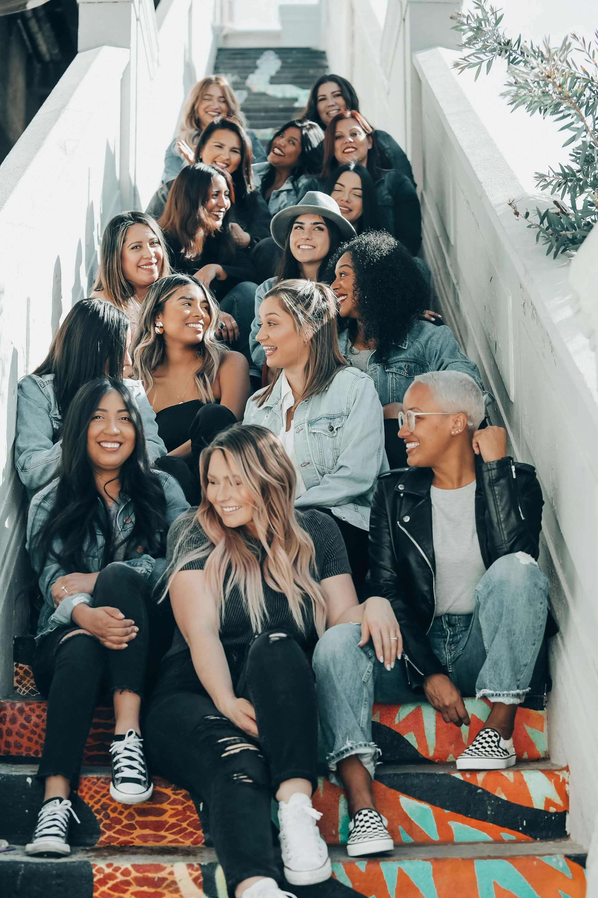 Group of women sitting on colorful steps