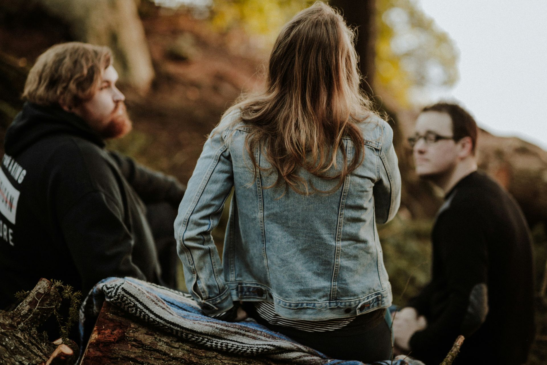 A group of people are sitting around talking