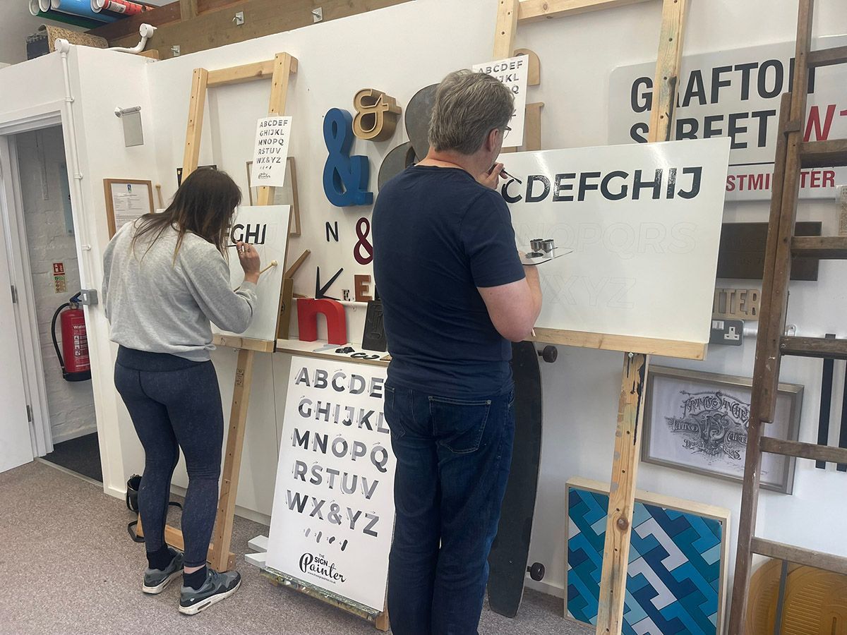 Learning the art of signwriting in Woking, Surrey