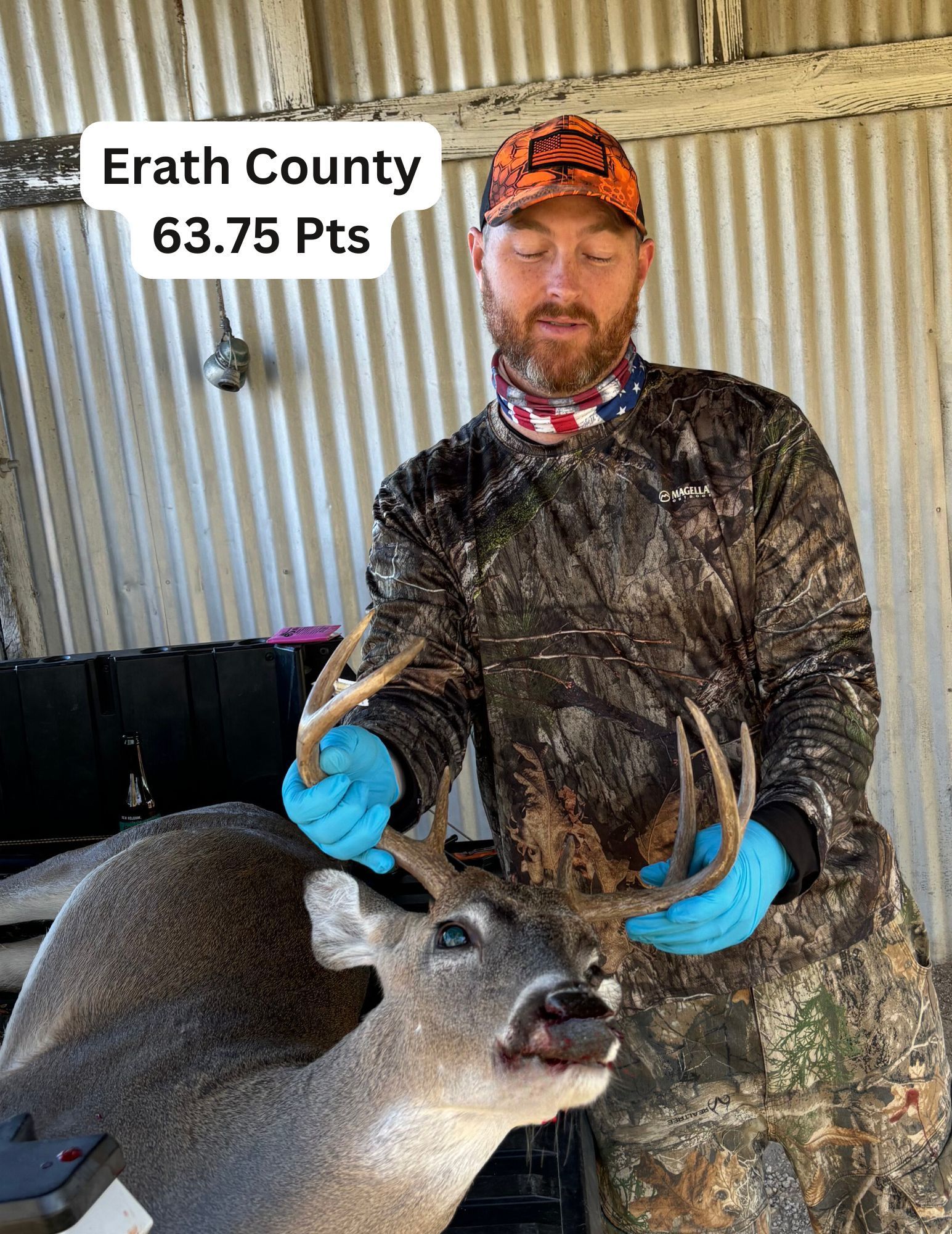 Man in camo holds deer antlers in Erath County. Deer has 63.75 points.