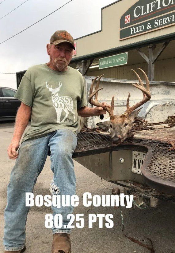 Man with deer head trophy in front of feed store in Bosque County, Texas. 80.25 points.