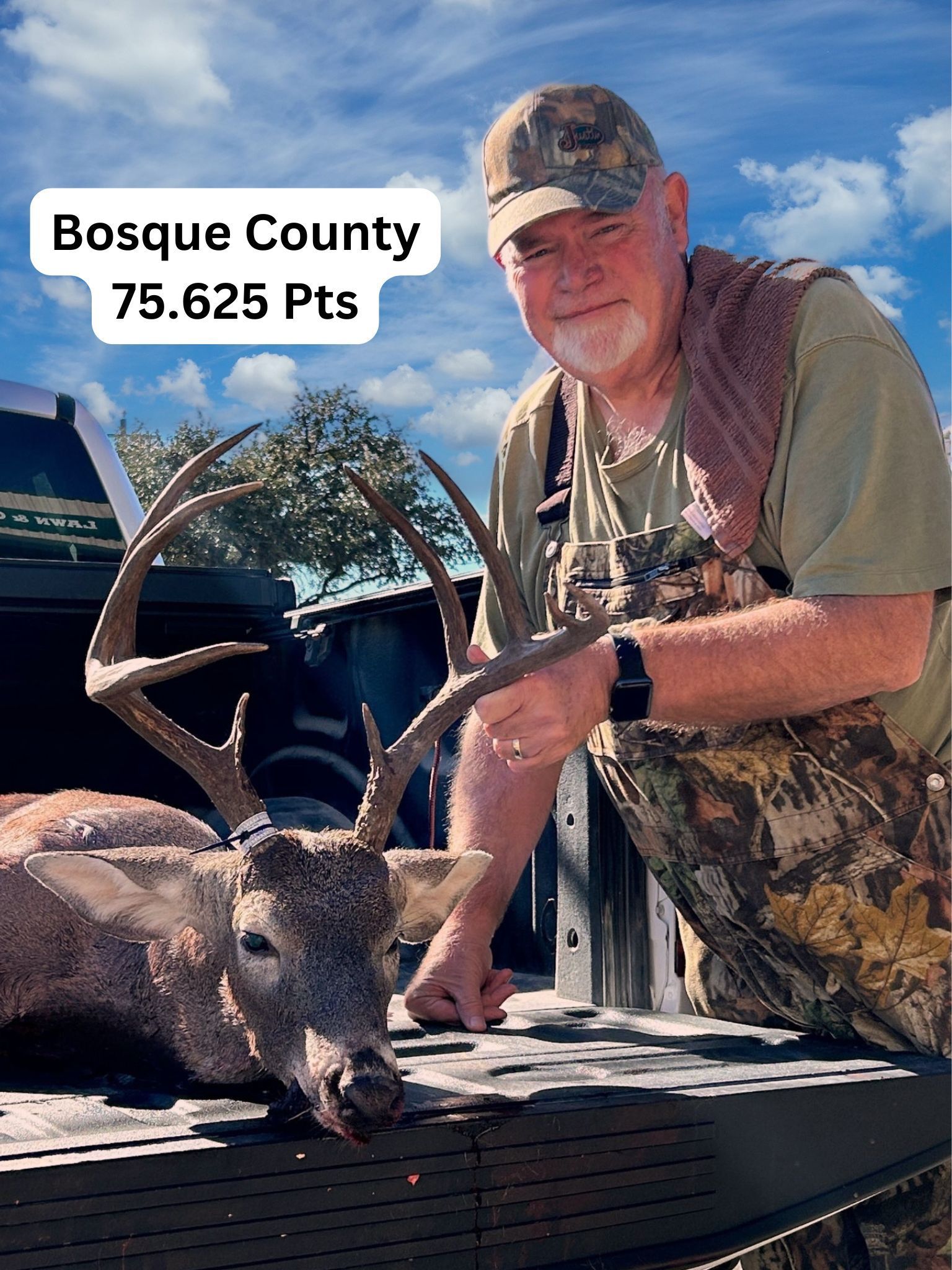 Man with a buck in a truck bed, Bosque County, Texas. 75.625 Points, blue sky.