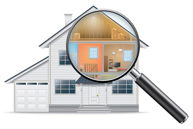 A magnifying glass positioned over a white house, revealing an interior cross-section of its rooms and attic.